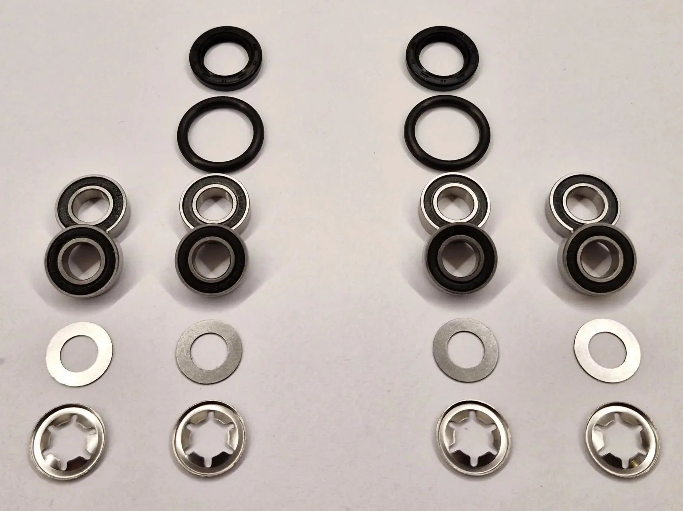 Repair kit for front wheels and turning bearings on Husqvarna Automower with 6mm wheel axle. Stainless bearings and lock washers.